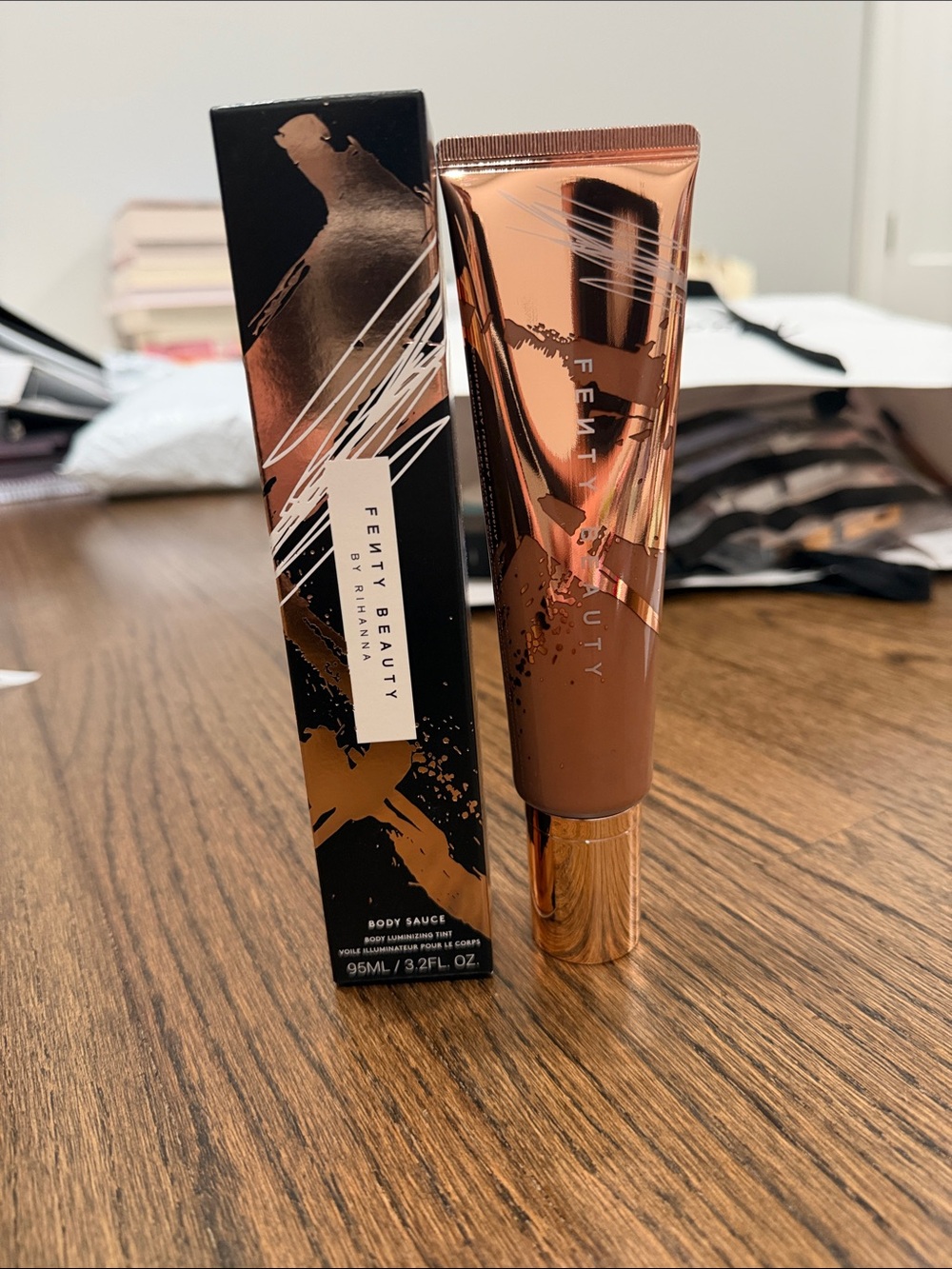 Fenty Beauty Body Sauce Luminizer - Bronze Rose Gold Tube
